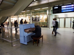 playing piano at St Pancras